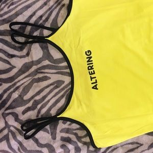 Strappy neon green bodysuit that says altering.